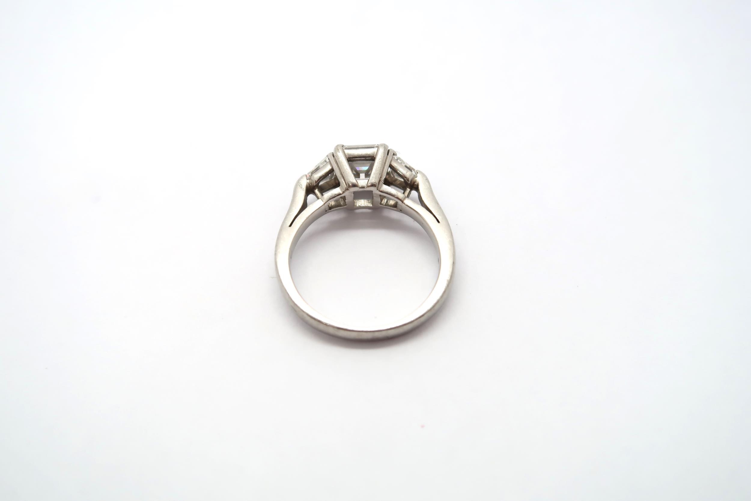 A very good platinum three stone diamond ring - The square emerald cut diamond estimated 1.1ct - Image 10 of 11