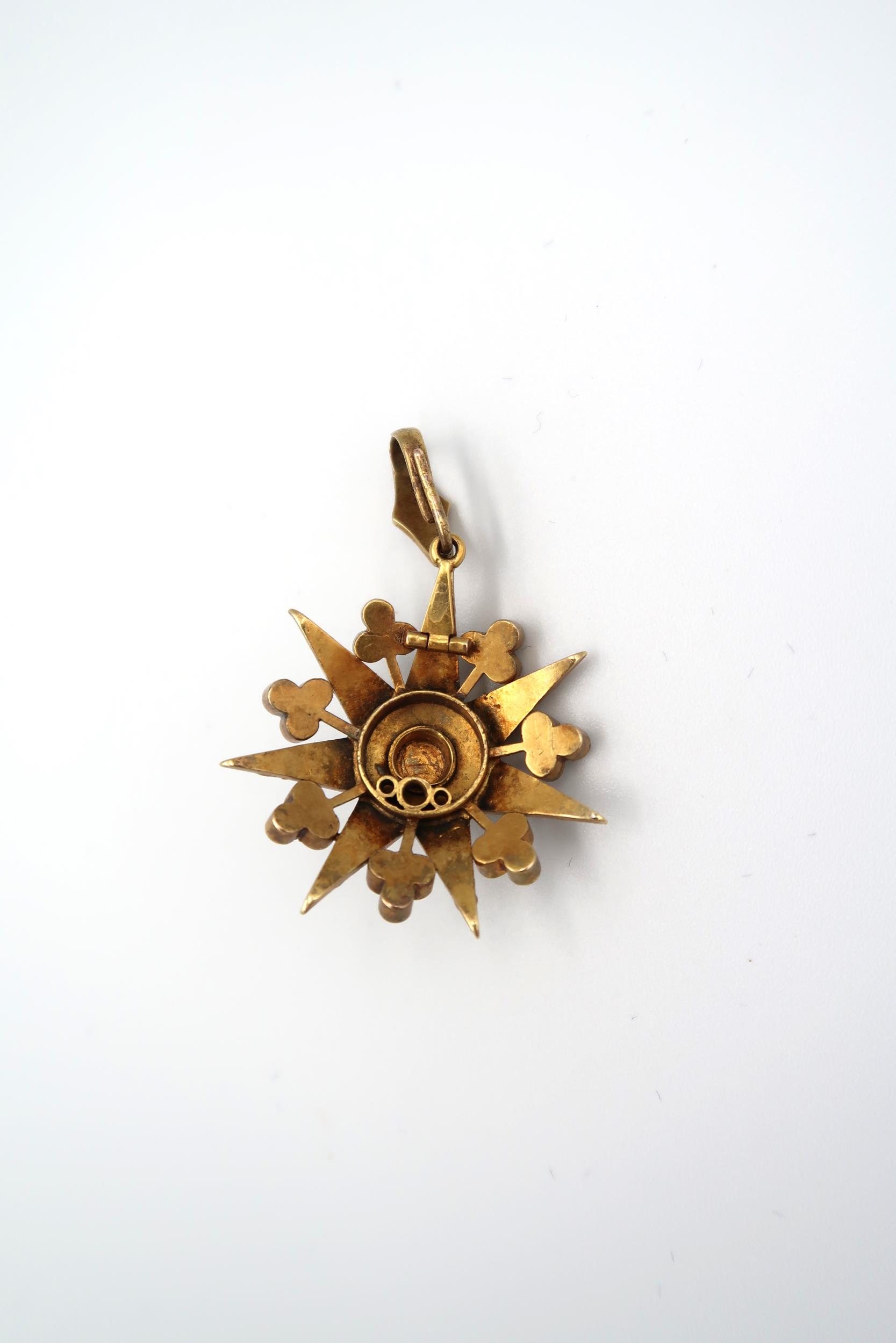 A seed pearl starburst pendant. Length 40mm. Width 30mm. Tests as approximately 15ct gold. Weight - Image 2 of 2