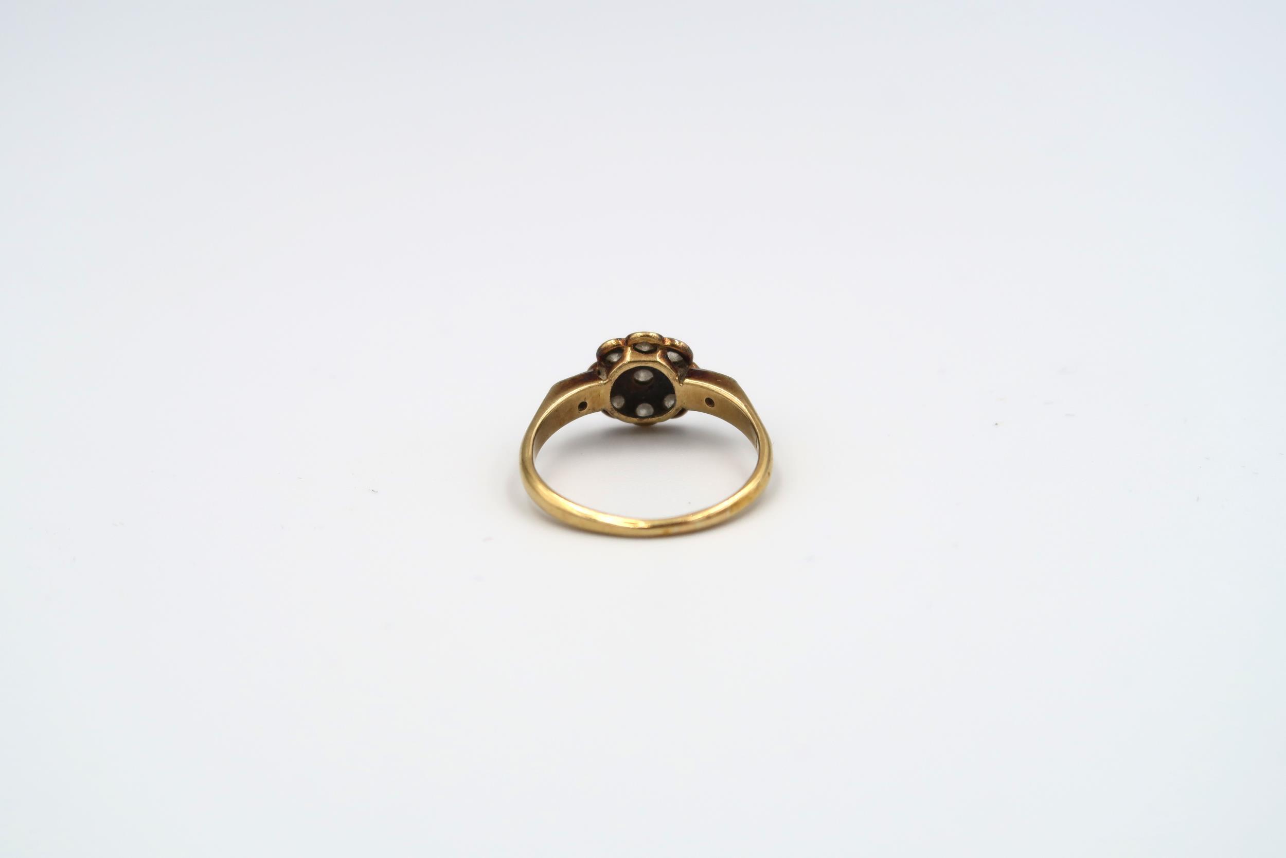 An old cut diamond daisy cluster ring with a diamond to each shoulder. Estimated total weight 0. - Image 4 of 7