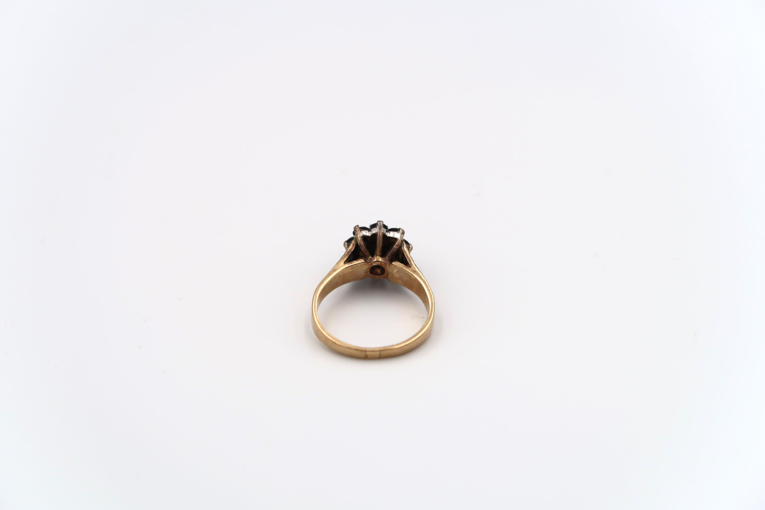 A 9ct gold sapphire and single cut diamond cluster ring with bark effect shoulders. Weight 3.49 - Image 6 of 6