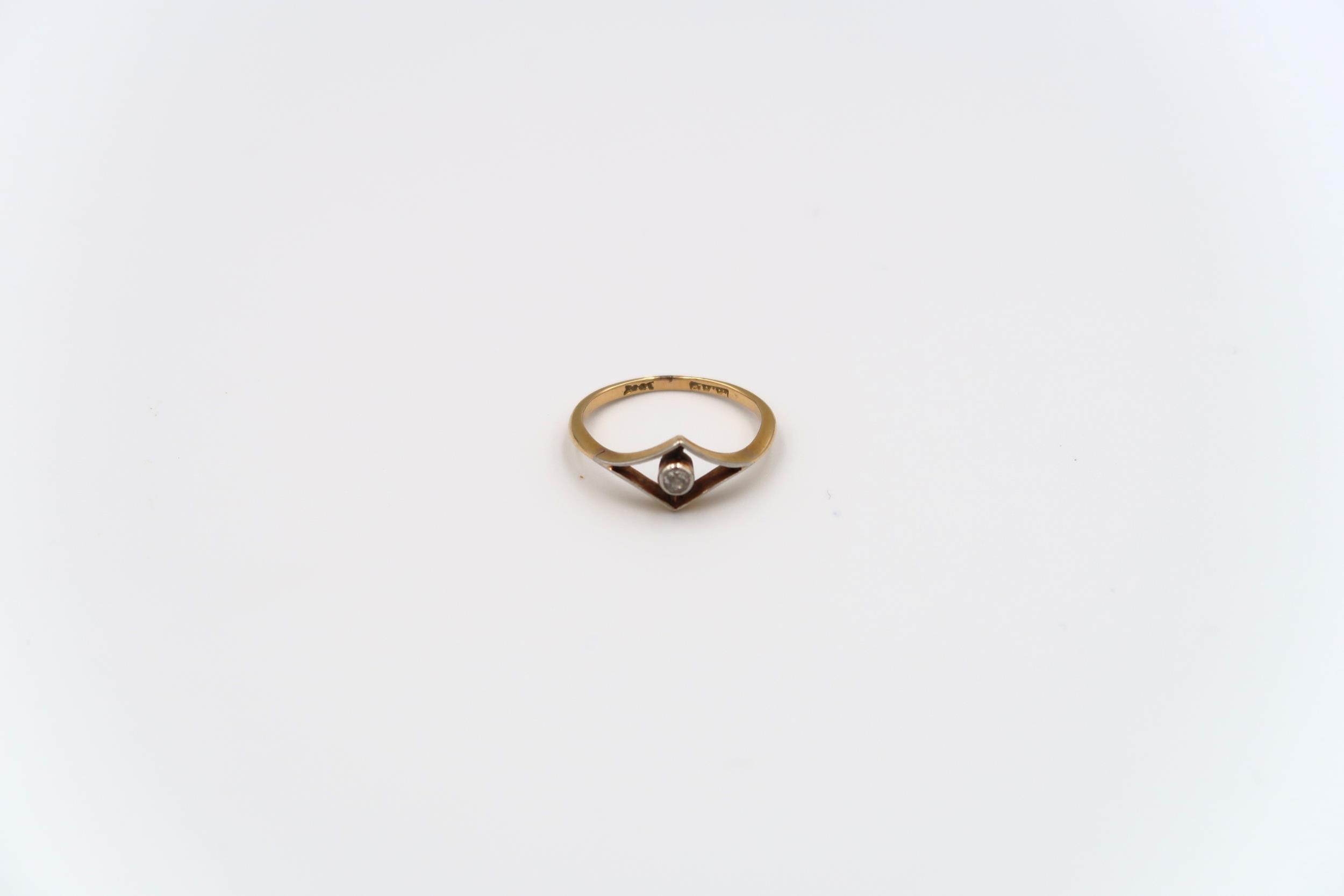 An old cut diamond dress ring estimated 0.06ct. Stamped 18ct, weight 1.69 grams, size L 1/2; a white