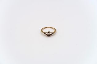 An old cut diamond dress ring estimated 0.06ct. Stamped 18ct, weight 1.69 grams, size L 1/2; a white