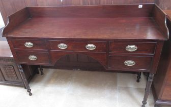 A Victorian mahogany five drawer double washstand/desk on turned legs with upper gallery - Width