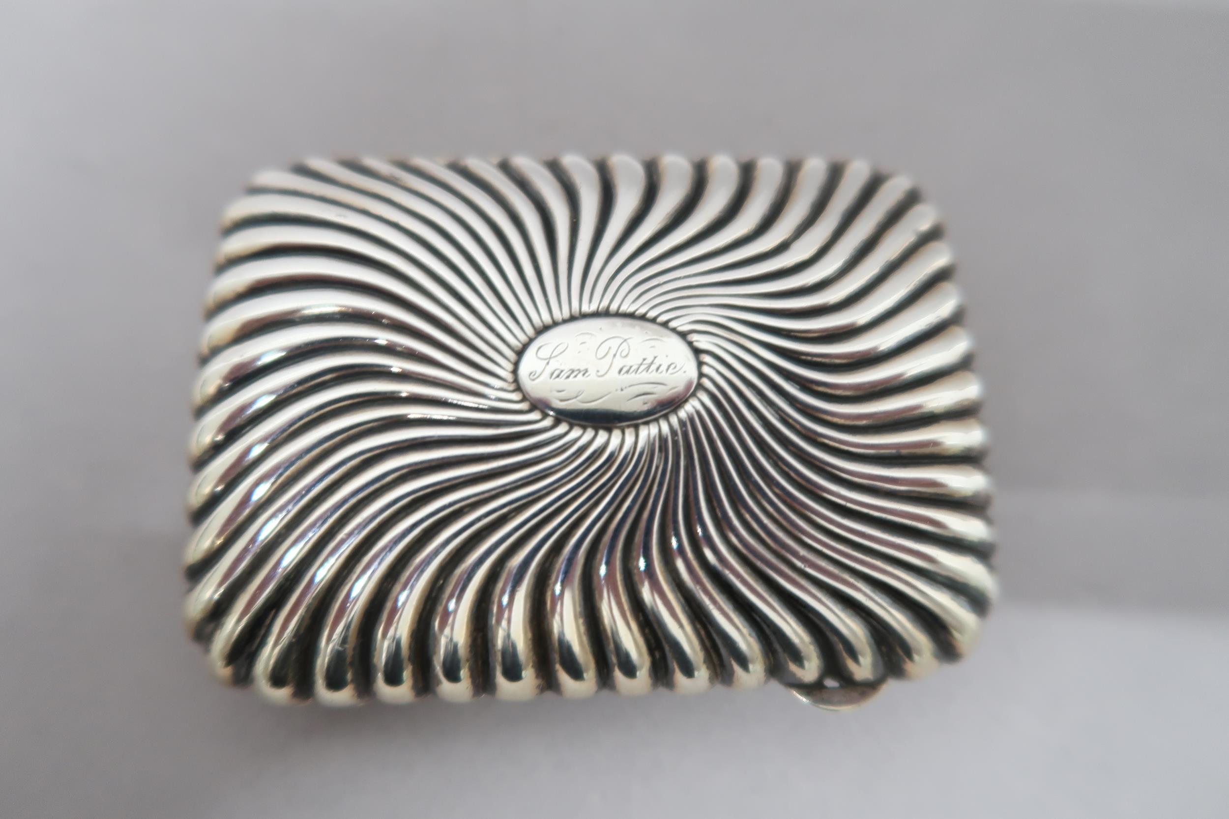 A silver cigarette case with ribbed decoration, approx 2.6 troy oz