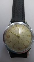 A gents Helvetia watch on brown leather strap - case size 32mm - not working