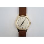 A gents Smiths automatic on a brown leather strap, running in saleroom