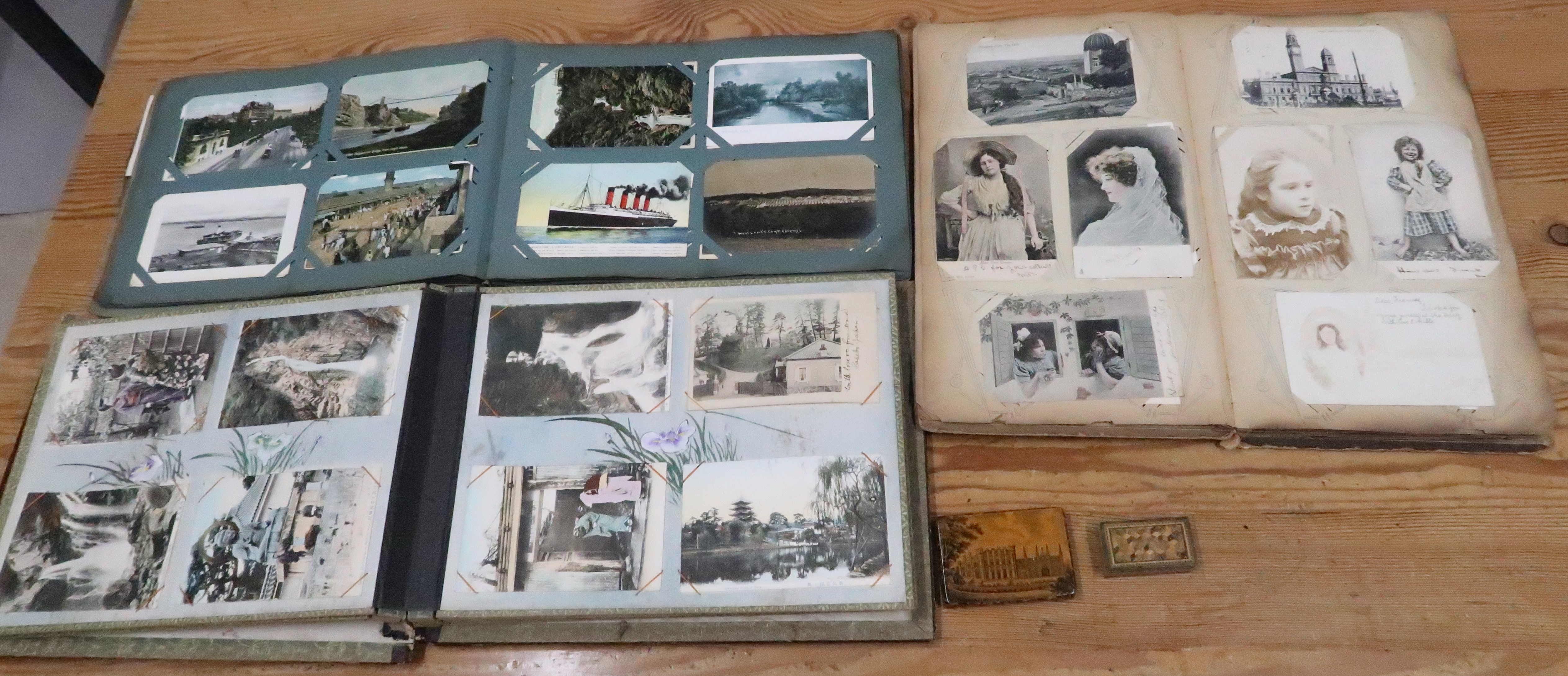 Three Albums of Vintage postcards, including Oriental, a Mauchline ware box and a small Tunbridge