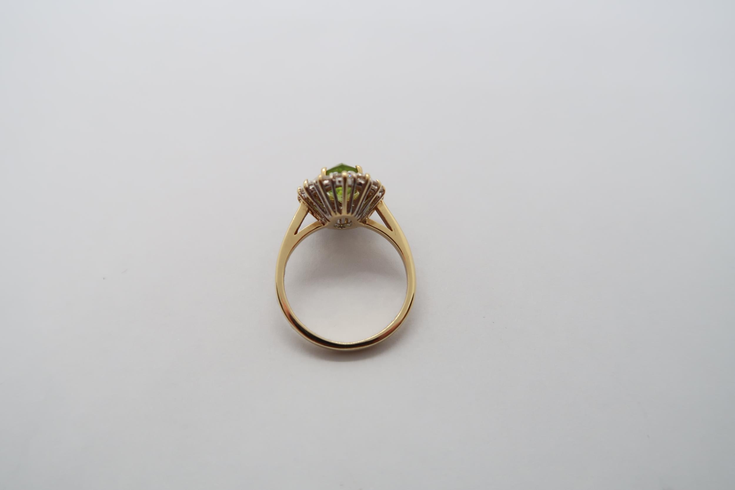 An 18ct yellow gold marquis cut peridot and diamond ring, peridot is good colour, diamonds bright - Image 3 of 3