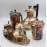 A selection of silver plated items including flatware, tea pot, milk, sugar, peppers etc