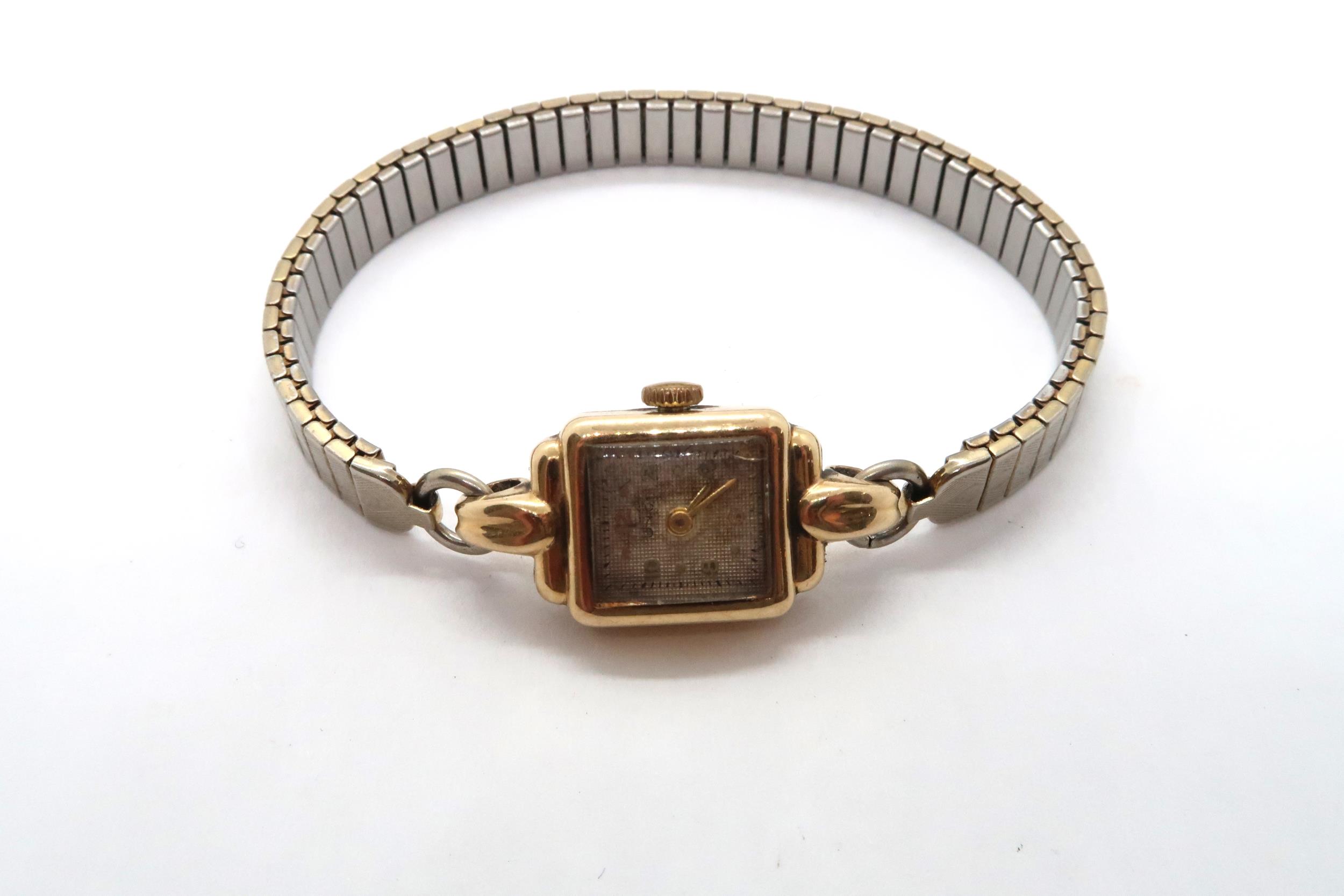 A 9ct yellow gold cased ladies watch on a bi-metal bracelet