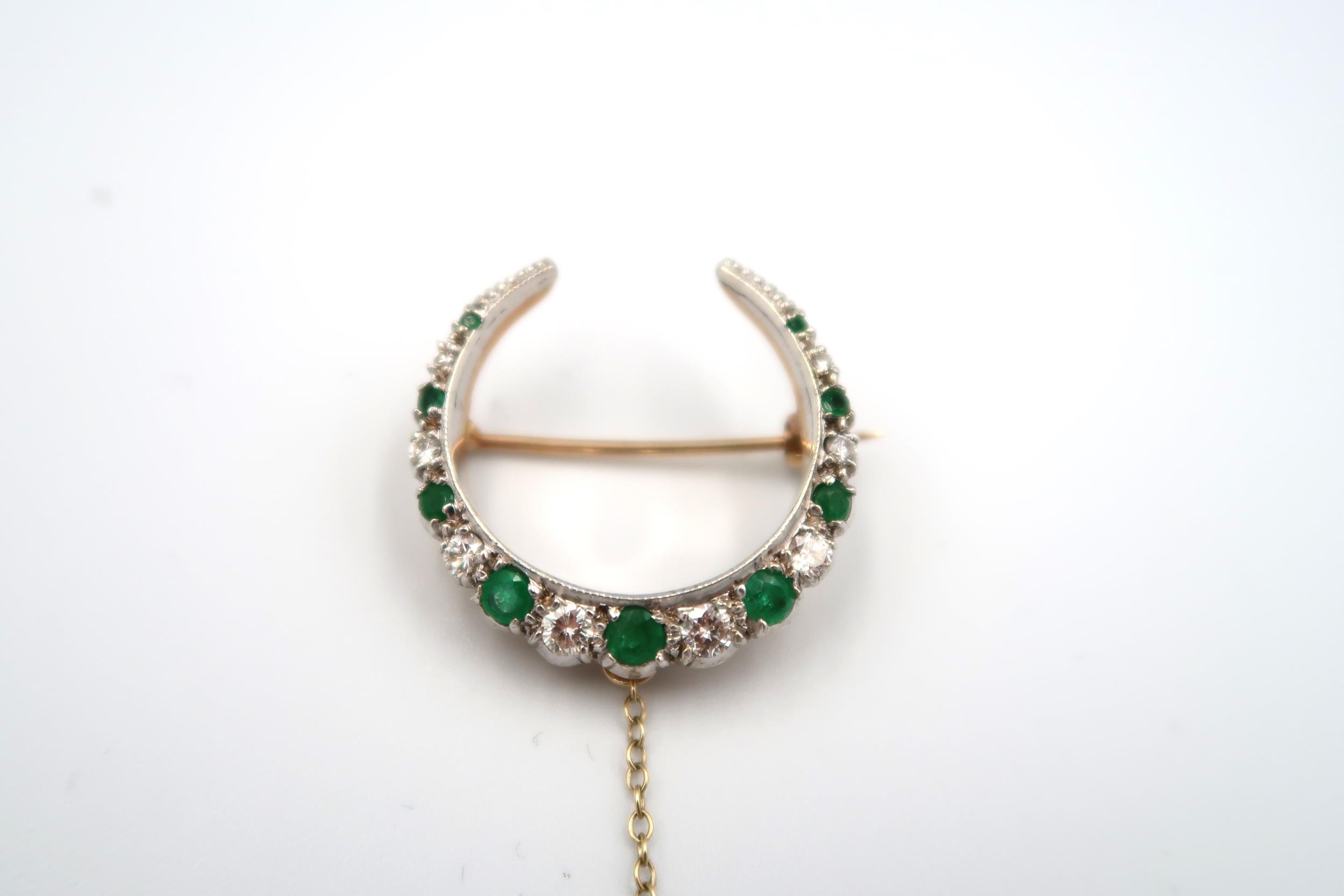 A 9ct gold graduated emerald and diamond crescent brooch. Composed of nine circular emeralds - Image 3 of 3