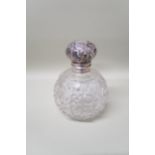 A cut glass scent bottle with silver lid and glass stopper, overall height 13cm