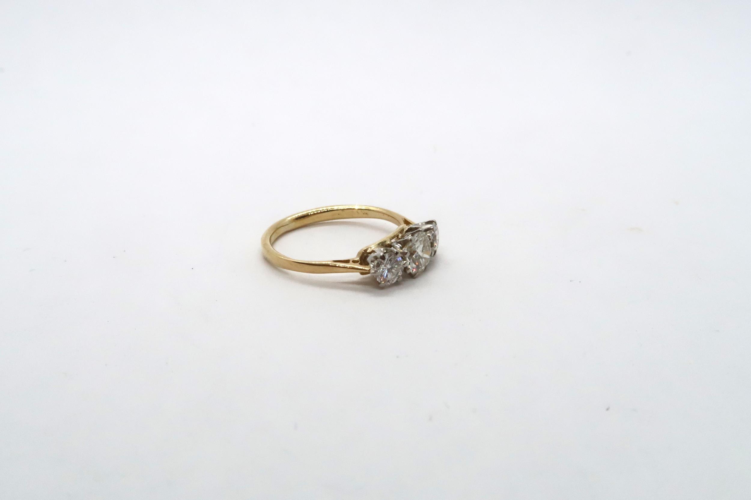 A three stone diamond and yellow metal ring, estimated I/J colour SI1- SI2 clarity, approx 0.75ct, - Image 2 of 3