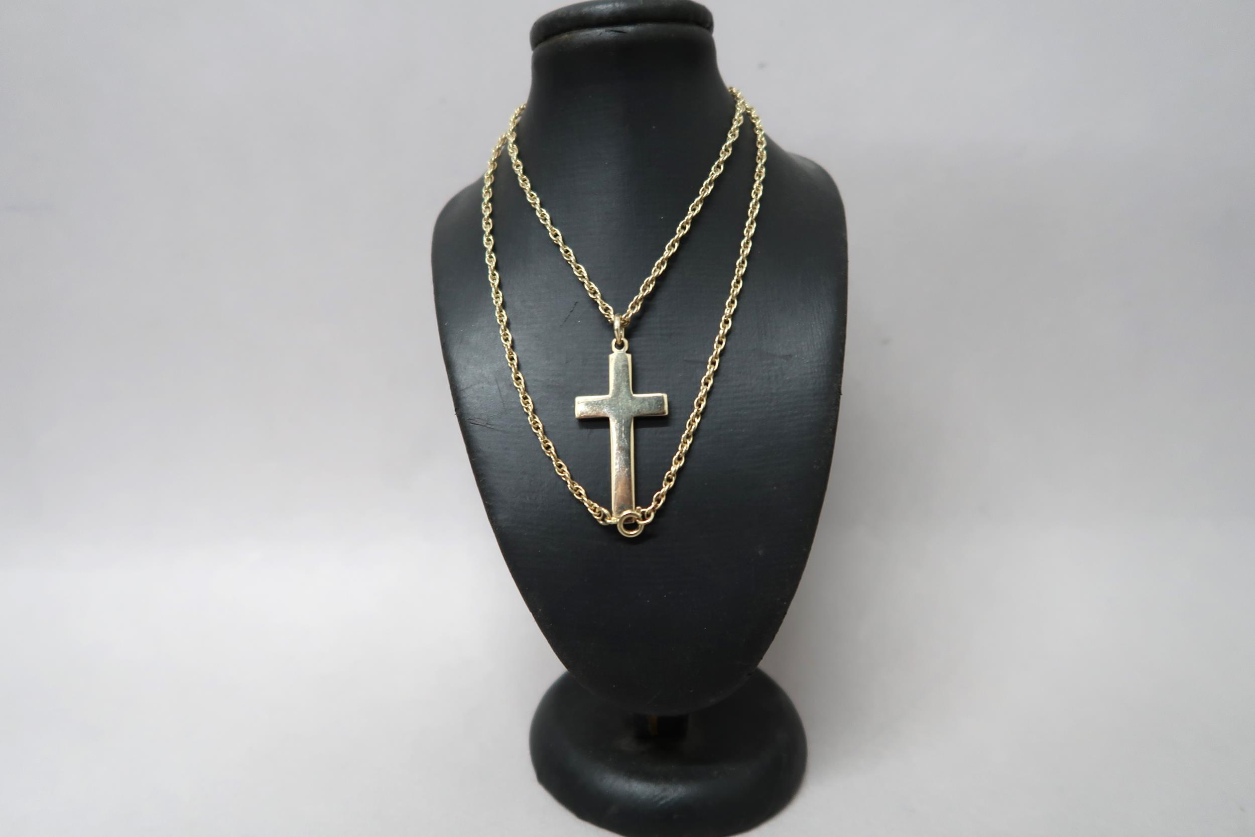 A 9ct gold crucifix on a 9ct gold chain, approx 12.3 grams