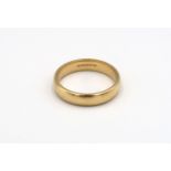 An 18ct yellow gold Wedding band, Size U. 7.48 grams