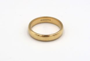 An 18ct yellow gold Wedding band, Size U. 7.48 grams