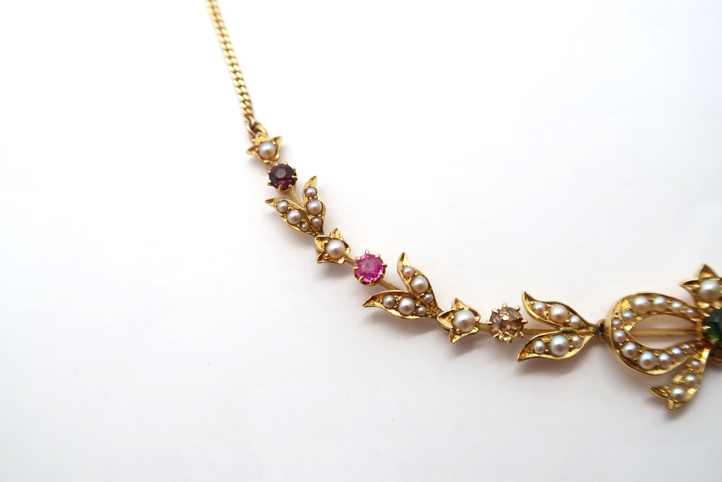 A seed pearl and gem set necklace, with central bow and foliate lines to the curb link chain. Gems - Image 3 of 6