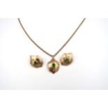 A 9ct gold and green paste set. Composed of a pendant and a pair of earrings of abstract shield