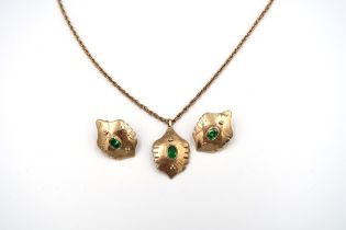 A 9ct gold and green paste set. Composed of a pendant and a pair of earrings of abstract shield