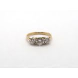 A three stone diamond and yellow metal ring, estimated I/J colour SI1- SI2 clarity, approx 0.75ct,