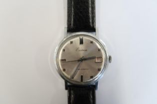 A Gents Eastman automatic watch with date on a black leather strap, running in saleroom