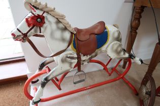 A 20th Century Metal rocking horse on metal frame.