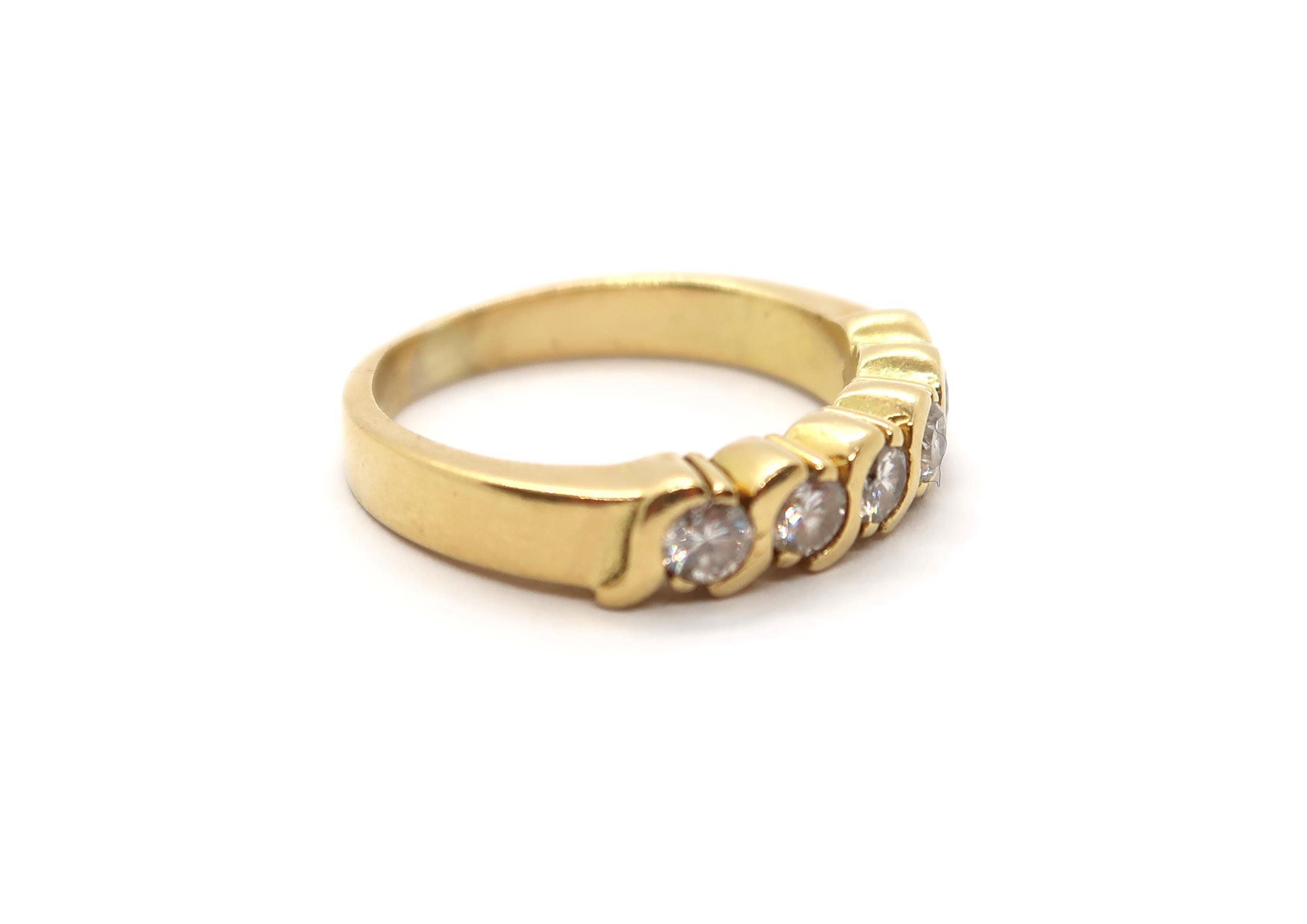 A diamond eternity ring in yellow colour metal, part hoop, comprising of five round brilliant cut - Image 2 of 3