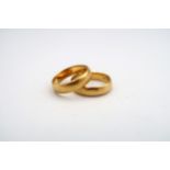 Two 22ct gold wedding bands, total weight 6.9 grams