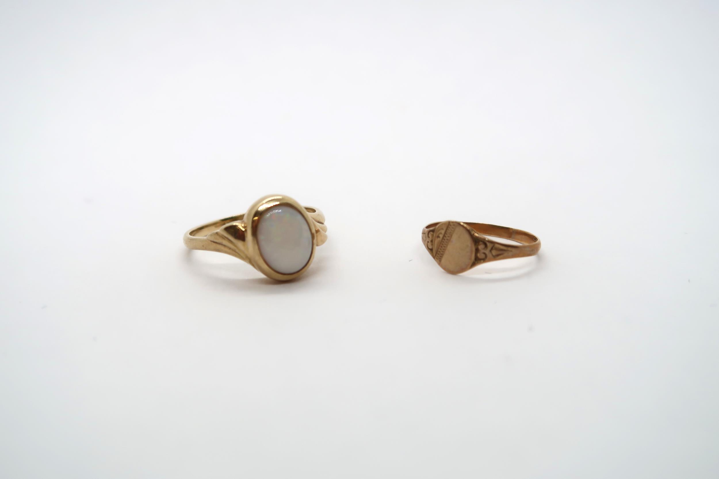 A yellow gold and opal ring unmarked, size O, approx 3 grams, a 9ct child's ring, size E, approx 0.