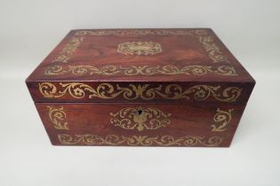 A brass inlaid sewing box, foliate design with a central cartouche and fitted interior