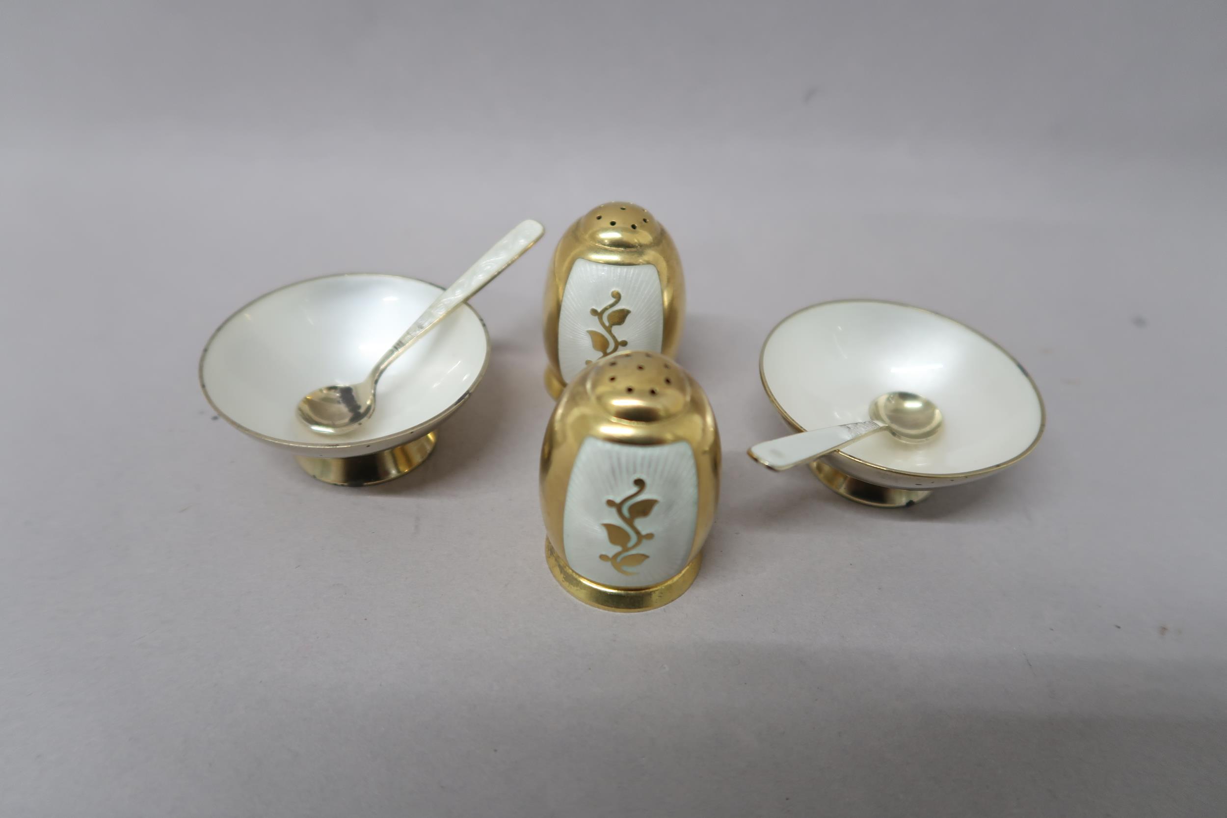 Two Volmer Bahner (Danish), (1912-1995) Gilded silver salt and pepper set, the salts decorated