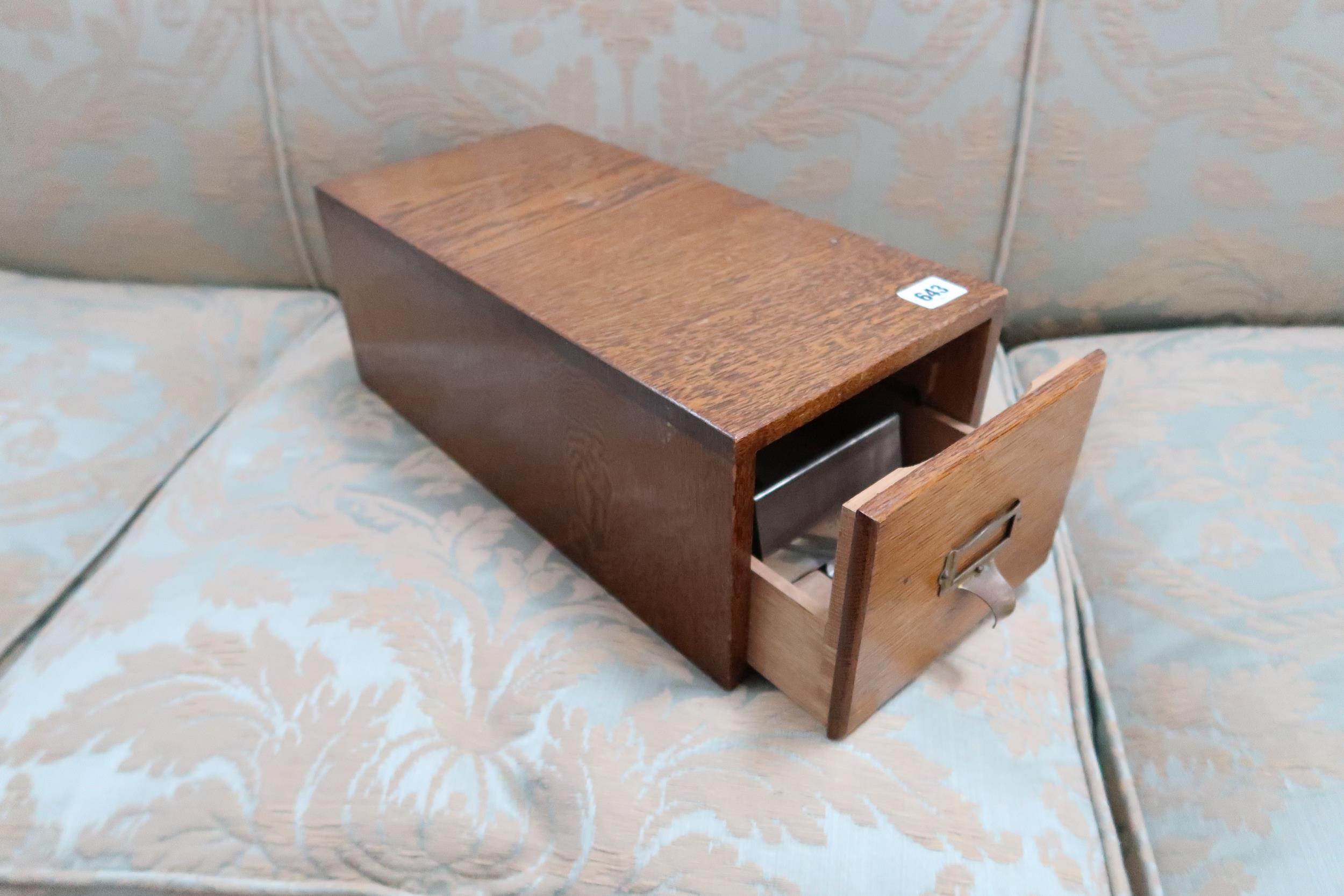 A table top oak filing drawer