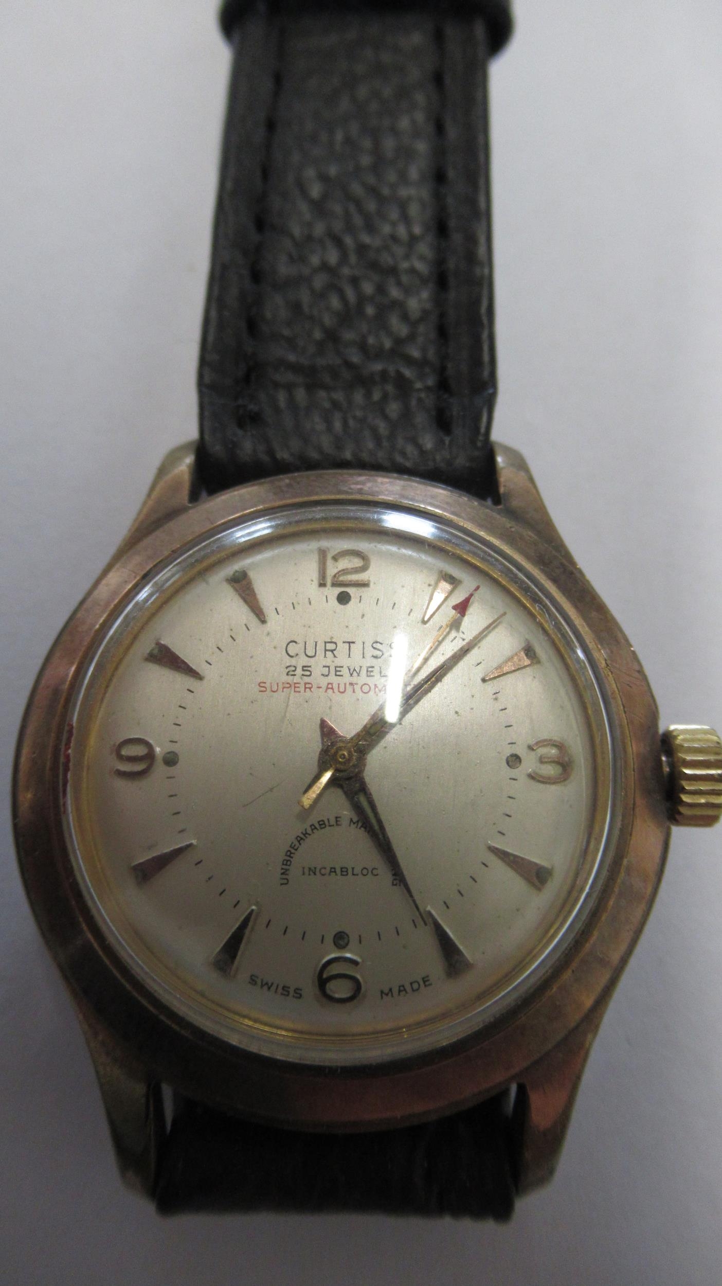A gents Curtiss auto with second hand on black leather strap - working in the saleroom - case size