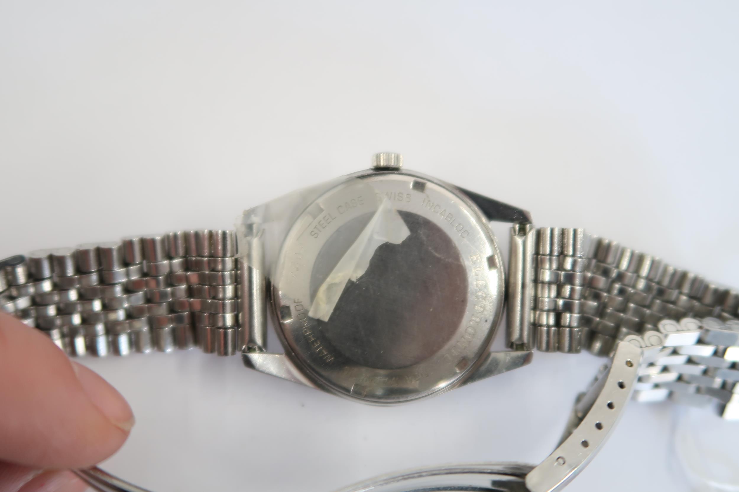 A Gents Rotary electric watch with date on a stainless steel bracelet, running in saleroom - Image 3 of 3
