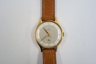 A Gents Smiths Deluxe automatic watch on a brown leather strap, running in saleroom