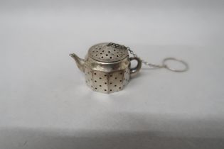 An American silver infuser in the form of a teapot