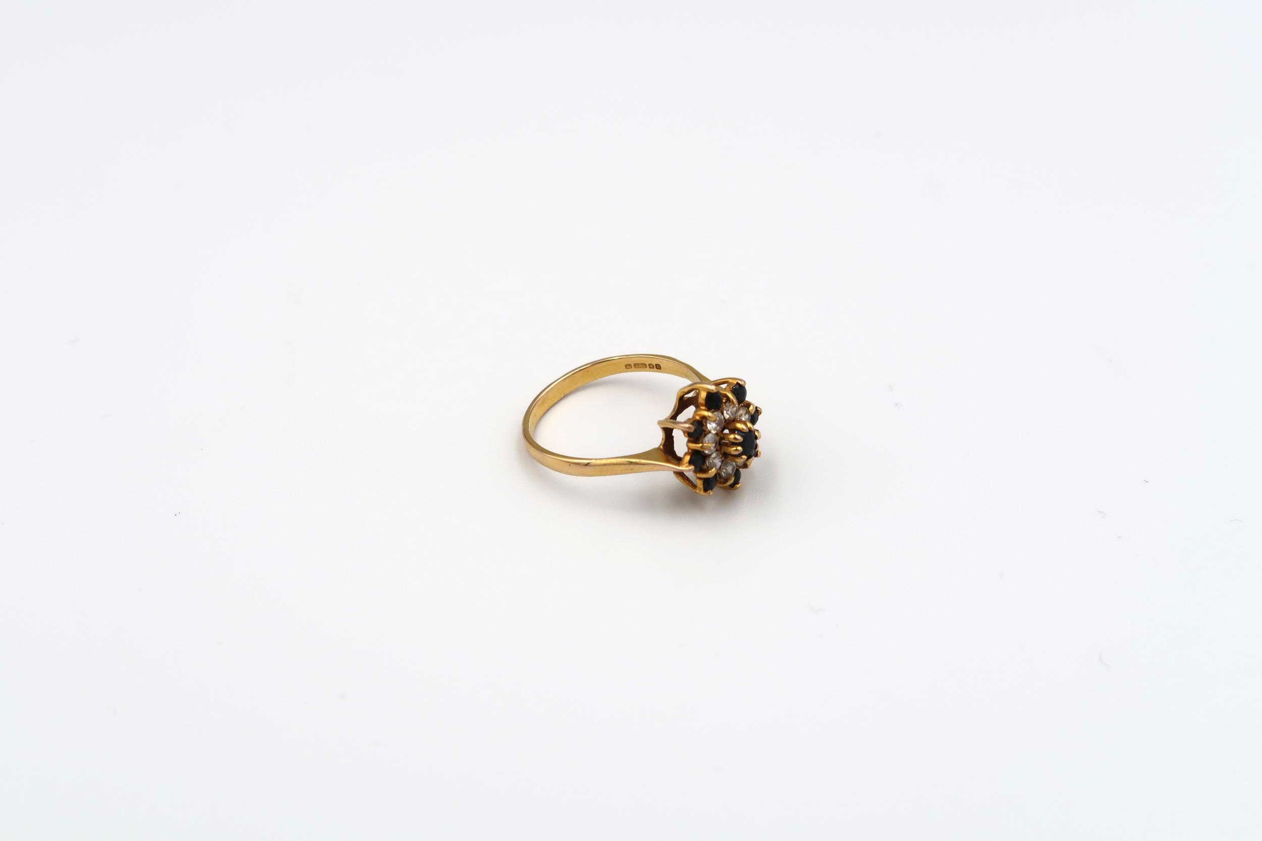 A 9ct gold sapphire and single cut diamond cluster ring with bark effect shoulders. Weight 3.49 - Image 2 of 6