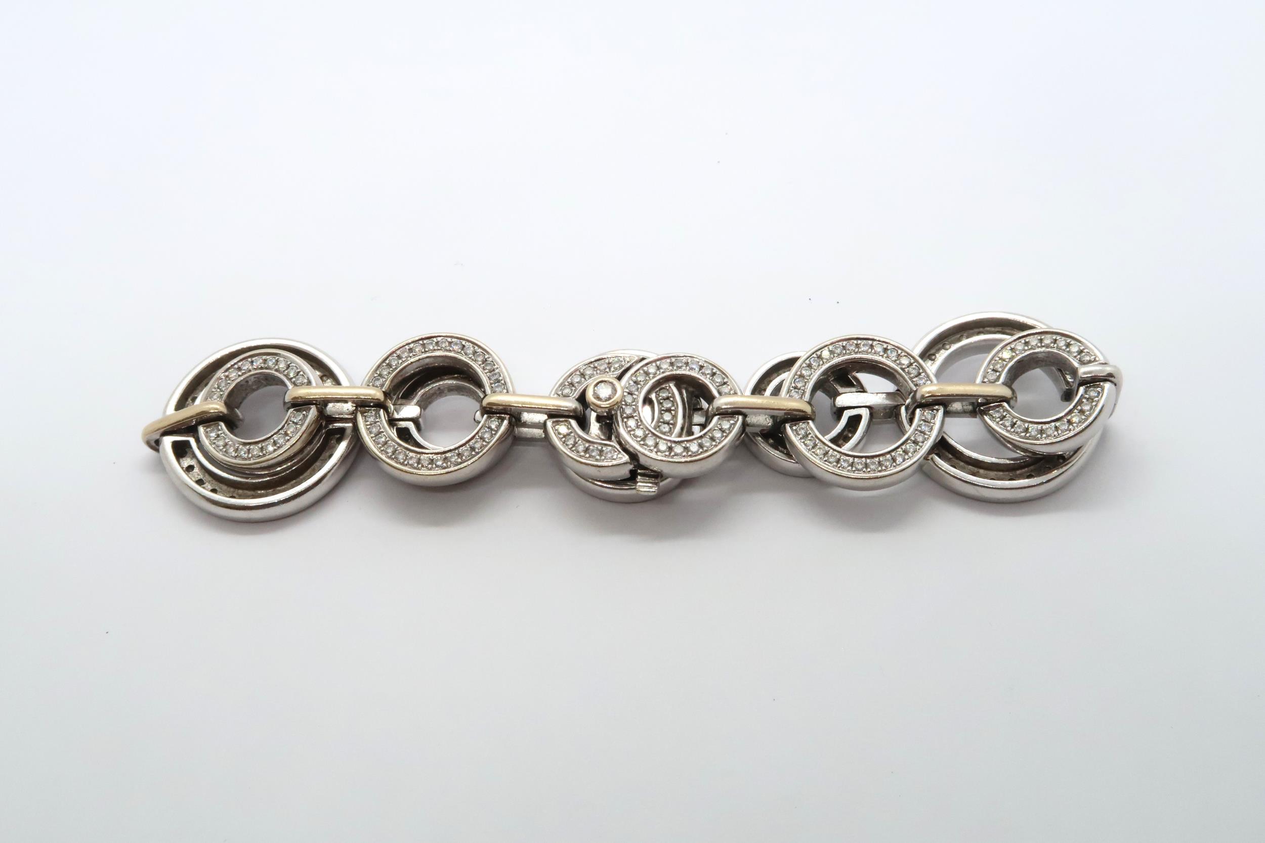 An 18ct white gold diamond set Boodles 'Roulette' bracelet, grain set with round brilliant cut - Image 5 of 6