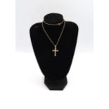 A 9ct yellow gold crucifix with 26 small cut diamonds on a 9ct gold chain, approx 5 grams