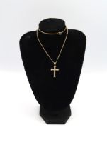 A 9ct yellow gold crucifix with 26 small cut diamonds on a 9ct gold chain, approx 5 grams