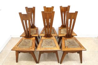 A set of six Liberty "Wiclif" oak dining chairs, Designed by Leonard Francis Wyburd, for Liberty and