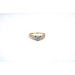 An 18ct gold and platinum ring with approx 0.15ct diamond to shoulder - approx weight 2.35 grams