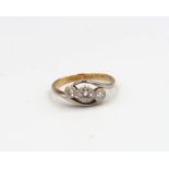 An old cut diamond three stone crossover ring. Estimated total diamond weight 0.35ct. Estimate I/J