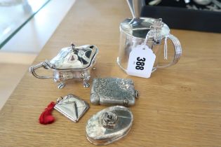 Hallmarked silver,including mustard with liner and spoon, one smaller without spoon, a vesta,