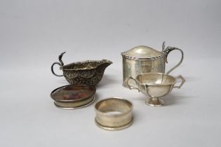 A silver hallmarked mustard without liner, London, a small twin handled cup, Birmingham, a napkin