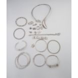 An assortment of 21 pieces of silver and white metal jewellery total weight 304.1 grams . Together