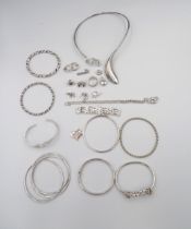An assortment of 21 pieces of silver and white metal jewellery total weight 304.1 grams . Together