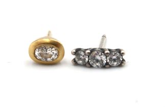 Two diamond earrings - one 18ct yellow gold an one unmarked white metal mounted