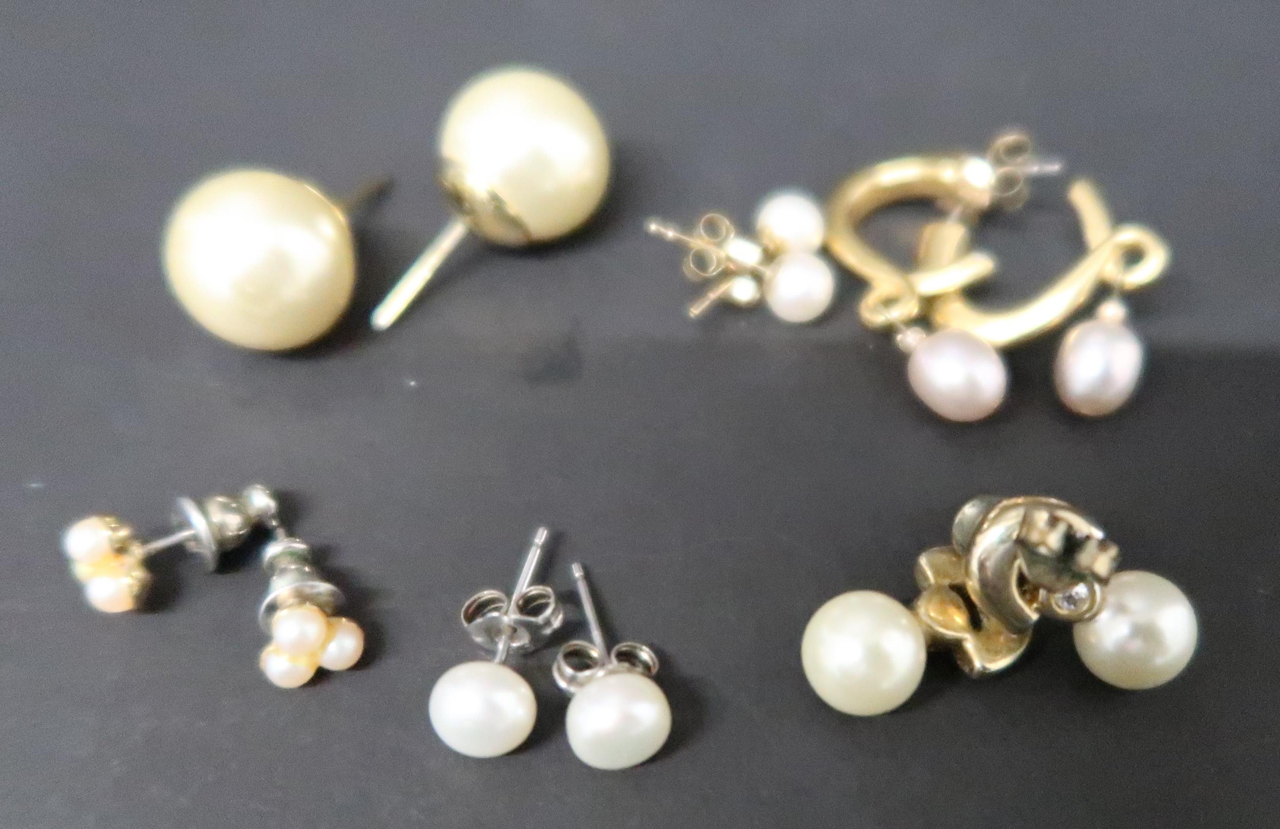Six pairs of yellow metal and pearl earrings