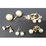 Six pairs of yellow metal and pearl earrings